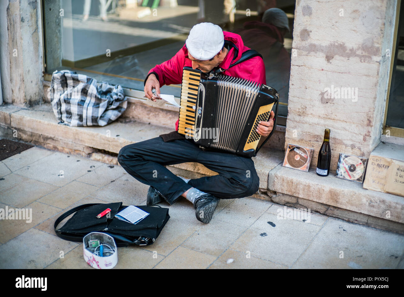 man playing on harmonium, Street market, Beaune, Burgundy, France, Europe. Stock Photo