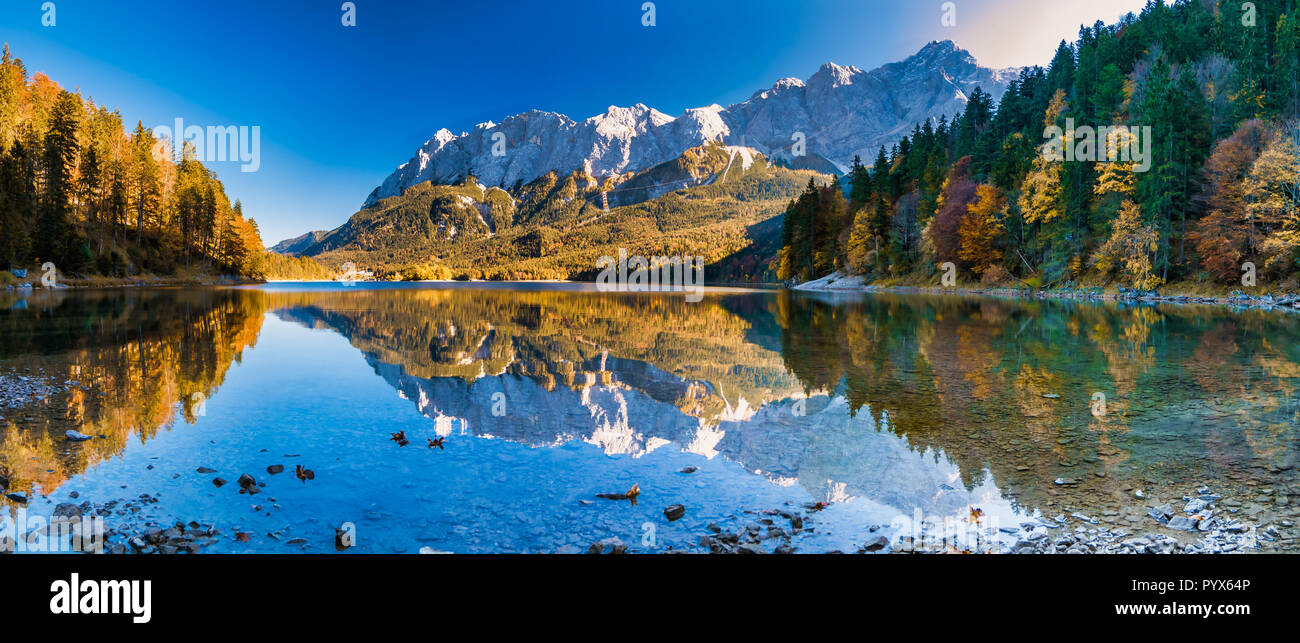 Panorama image of the zugspitze with water reflection in the eibsee ...