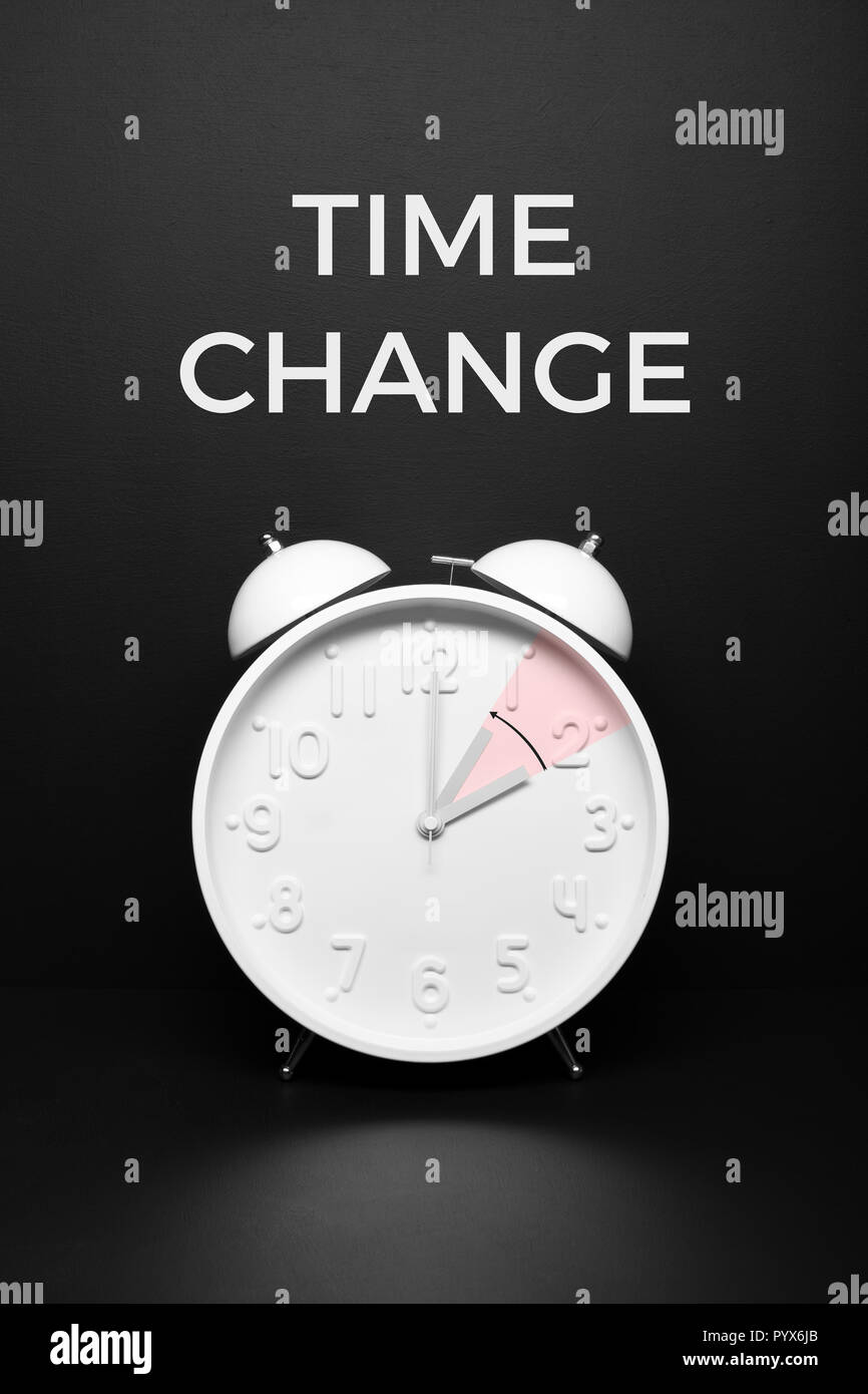 Time change Fall back concept. Black background text Stock Photo