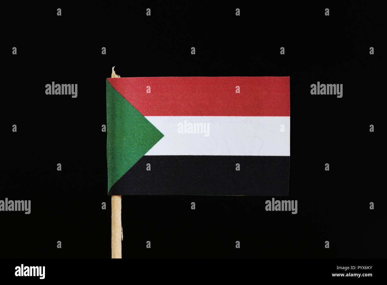 A Official Flag Of Sudan On Toothpick On Black Background Flag Consists Of A Horizontal Red 