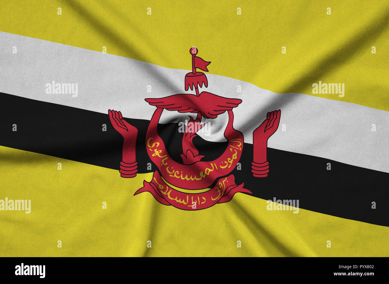 Brunei Darussalam flag is depicted on a sports cloth fabric with many