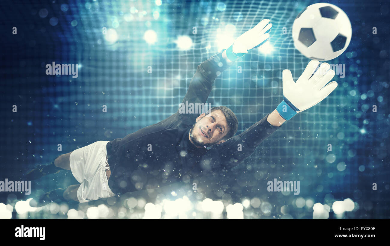 Close up of a goalkeeper dives to save a shot aimed at the goal with light effects Stock Photo