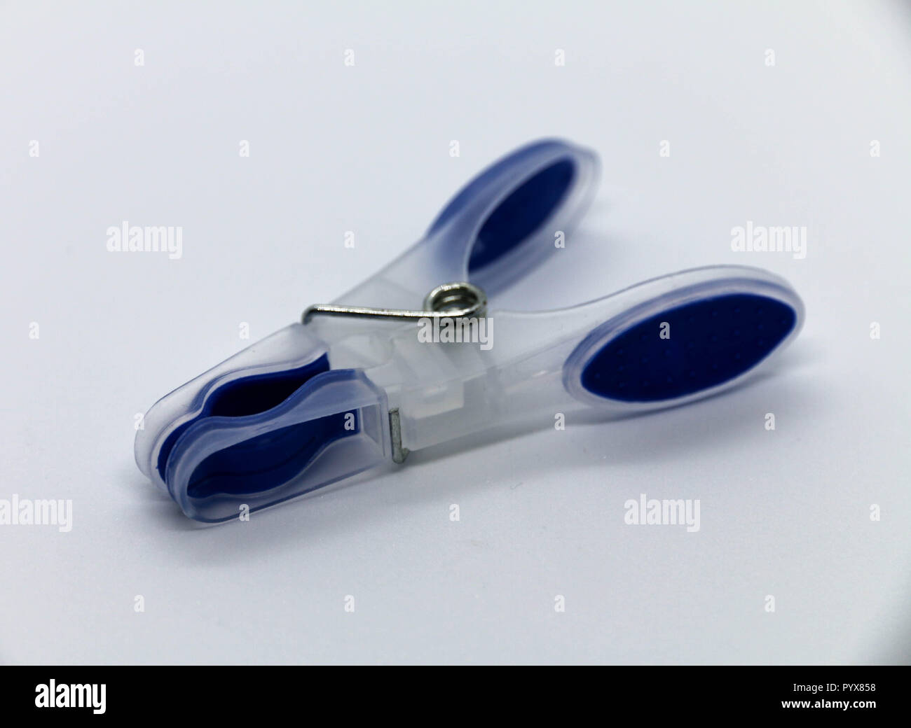 Close look of a blue plastic clothesline clip Stock Photo