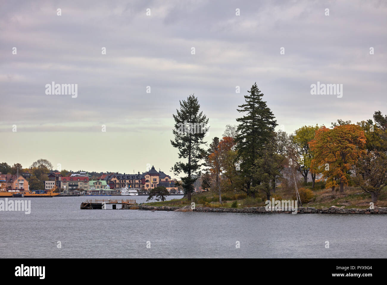 Boat view towards the Stora Ekholmen islet and Vaxholm city in the background near Stockholm, Sweden Stock Photo