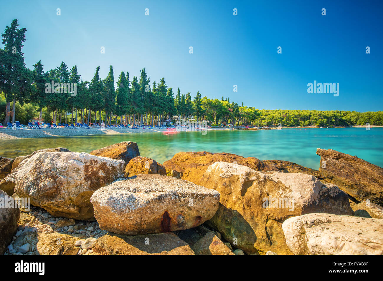 Beach in Supetar town on Brac island with turquoise clear water, Supetar, Brac, Croatia, Europe Stock Photo