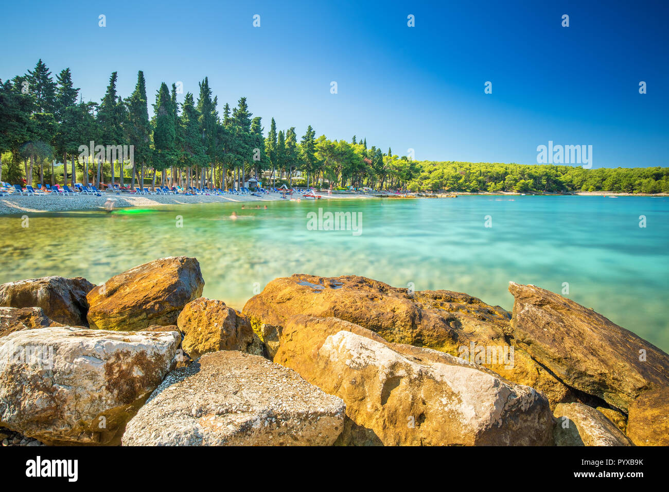 Beach in Supetar town on Brac island with turquoise clear water, Supetar, Brac, Croatia, Europe. Stock Photo