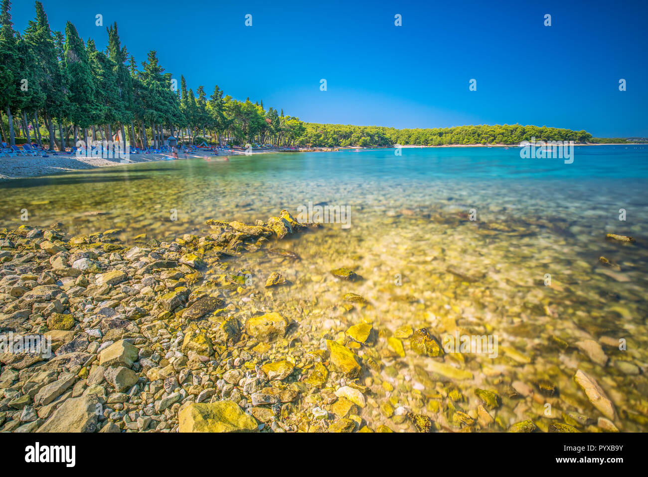 Beach in Supetar town on Brac island with turquoise clear water, Supetar, Brac, Croatia, Europe. Stock Photo