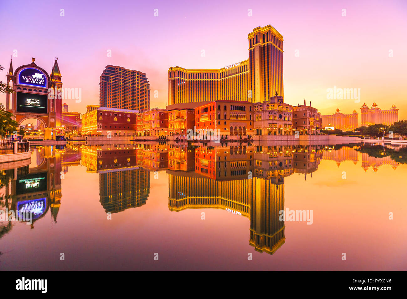 Macau, China - December 8, 2016: The Venetian Macao Sunset reflecting in the lake. The largest casino in the world. Stock Photo