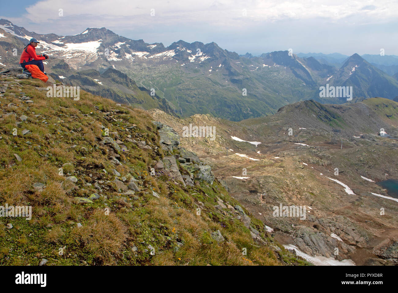 Hiker resting near Col d'Olen on the Tour de Monte Rosa Stock Photo