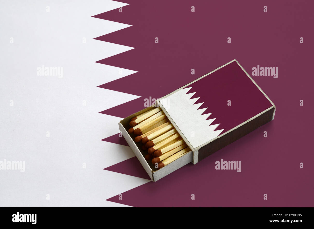 Qatar flag is shown in an open matchbox, which is filled with matches