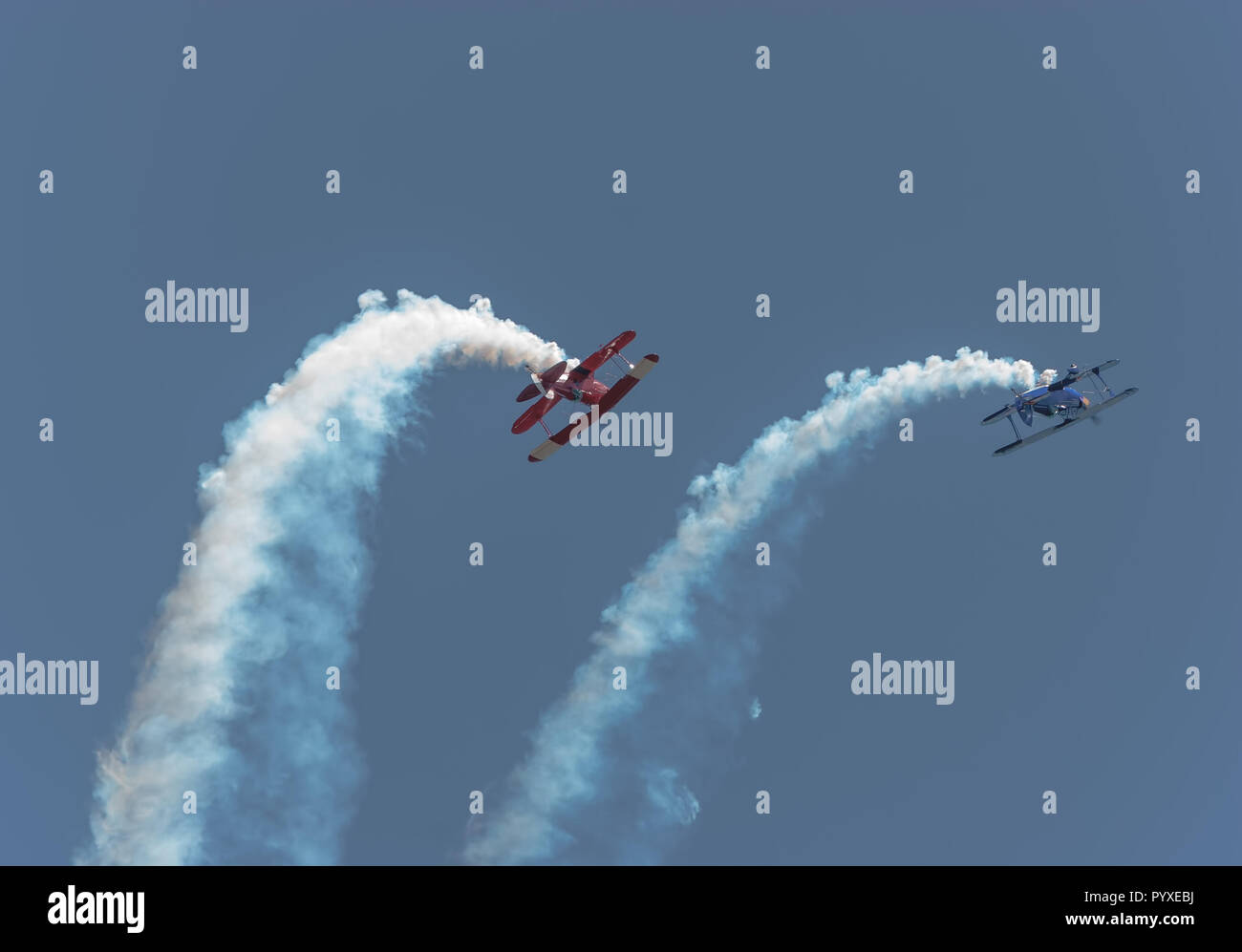 Bi-planes looping in the air Stock Photo - Alamy
