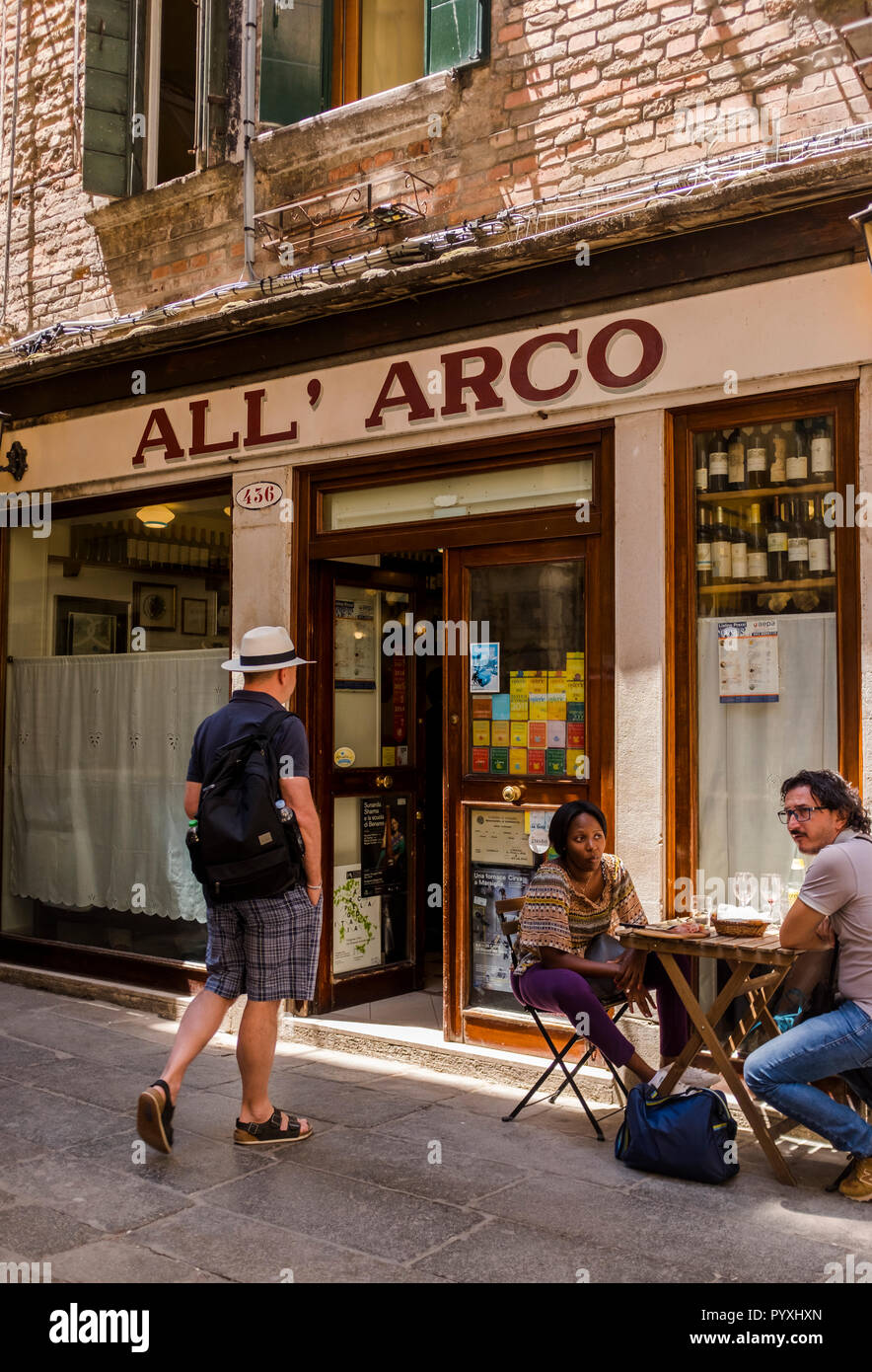 Patrons at a legendary bar called All' Arco, where the