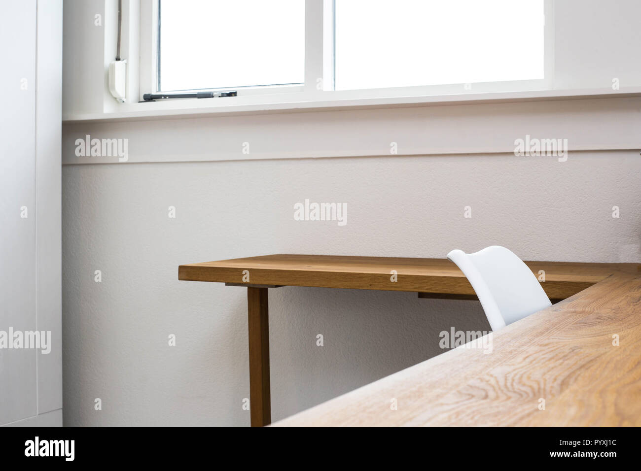 Wooden Table With Concrete Wall Background Chair And Desk Near