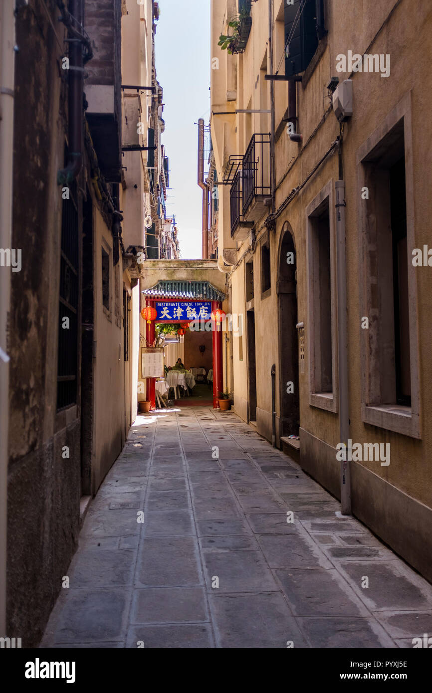 A Chinese restaurant entrance, located down a narrow street in Venice, Italy Stock Photo