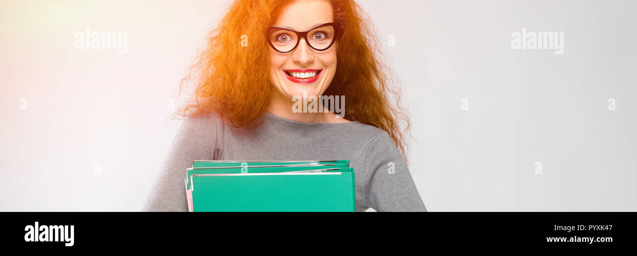 Young woman holding green folder Stock Photo