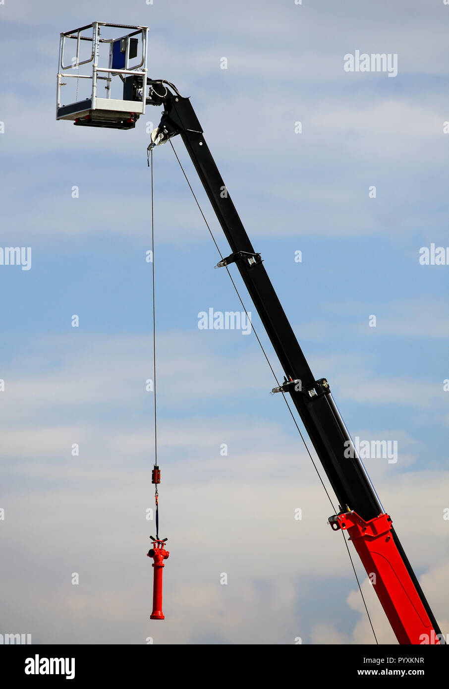Boom of a truckmounted crane with a winch and hook for catching a load
