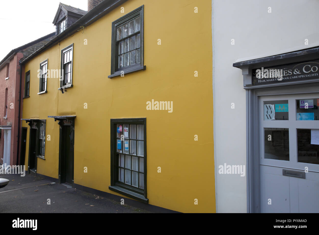 Yellow house in Castle, UK Stock Photo Alamy