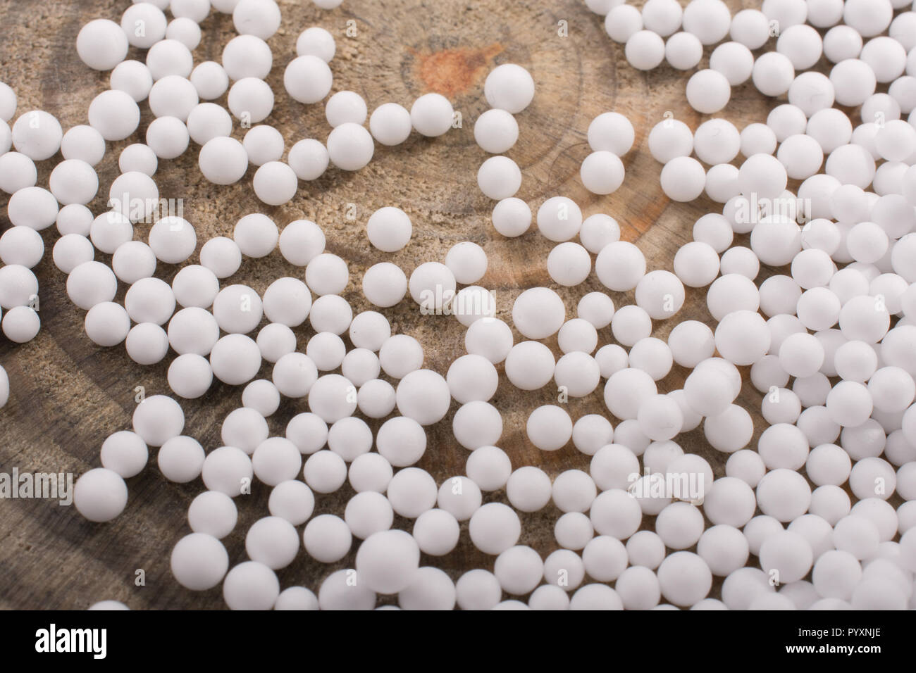 White little polystyrene foam balls as background Stock Photo - Alamy