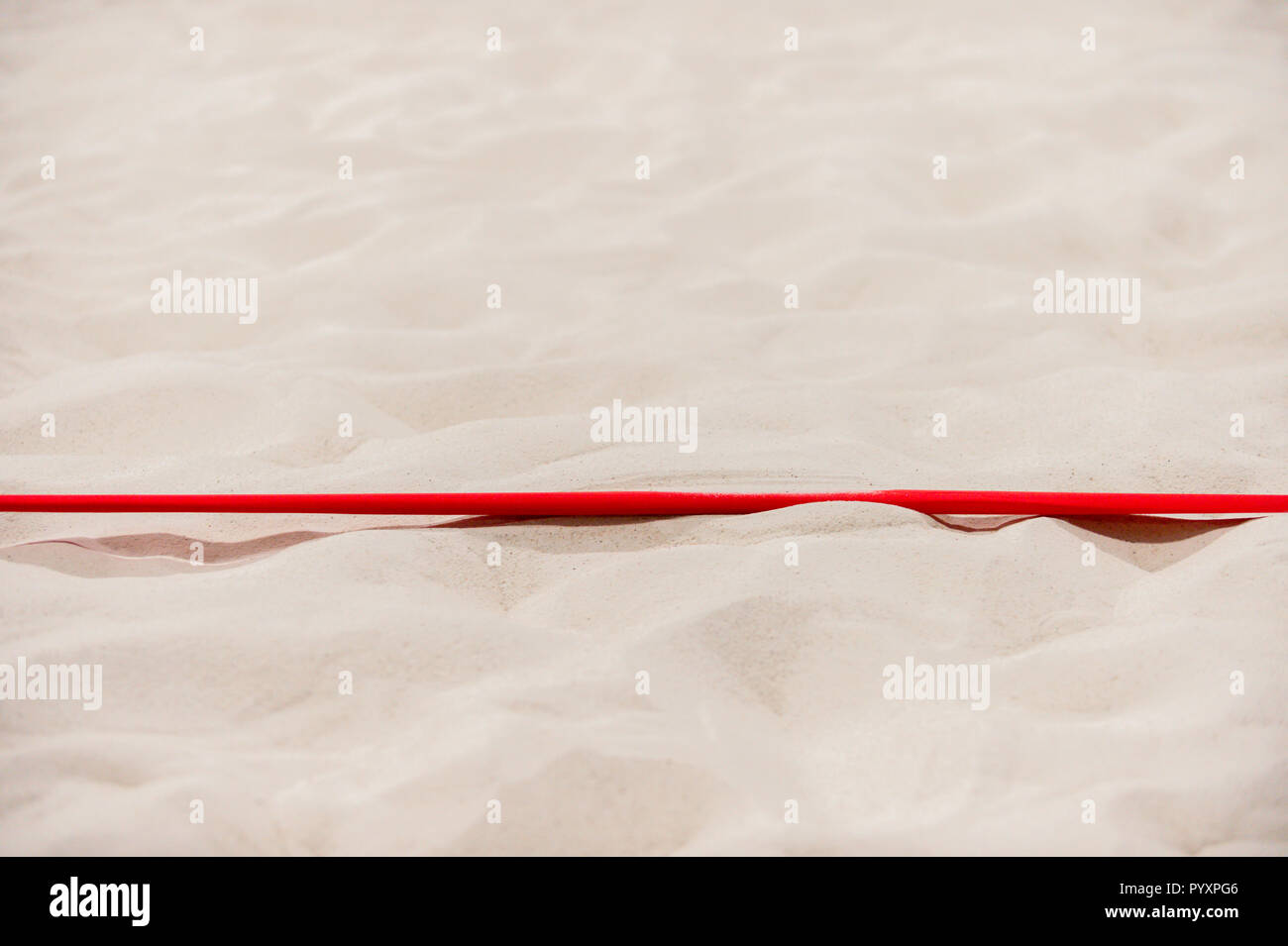 beach volleyball court up close and in detail with red plastic line