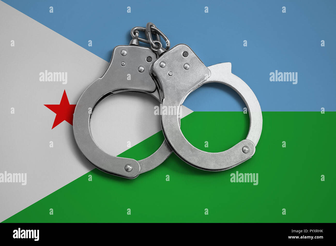 Djibouti flag  and police handcuffs. The concept of observance of the law in the country and protection from crime. Stock Photo
