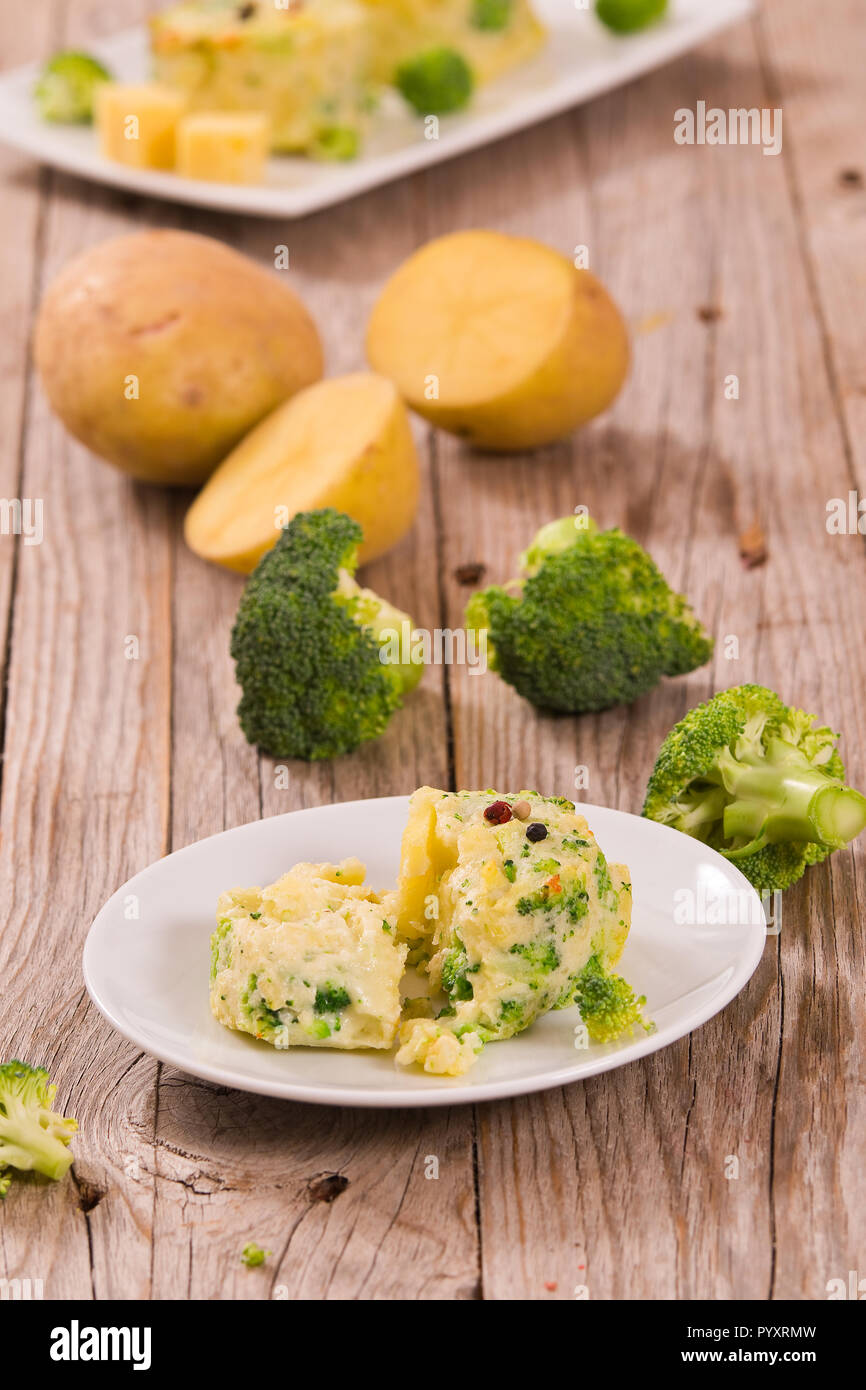 Potato Gratins With Broccoli Florets Stock Photo - Alamy