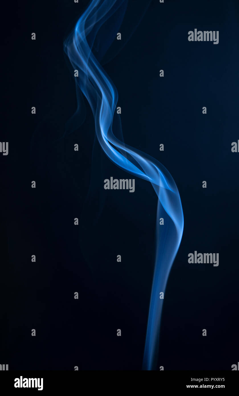 Abstract blue smoke swirls on dark background Stock Photo - Alamy