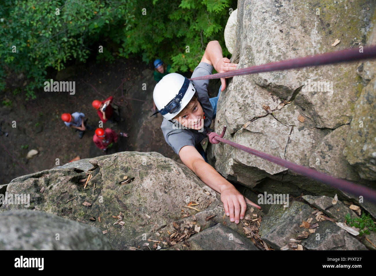 North America, Canada, Ontario, near Ravenna, Metcalfe Rock, Niagara Escarpment named in 1990 by UNESCO as a World Biosphere Reserve boy rock climbing Stock Photo