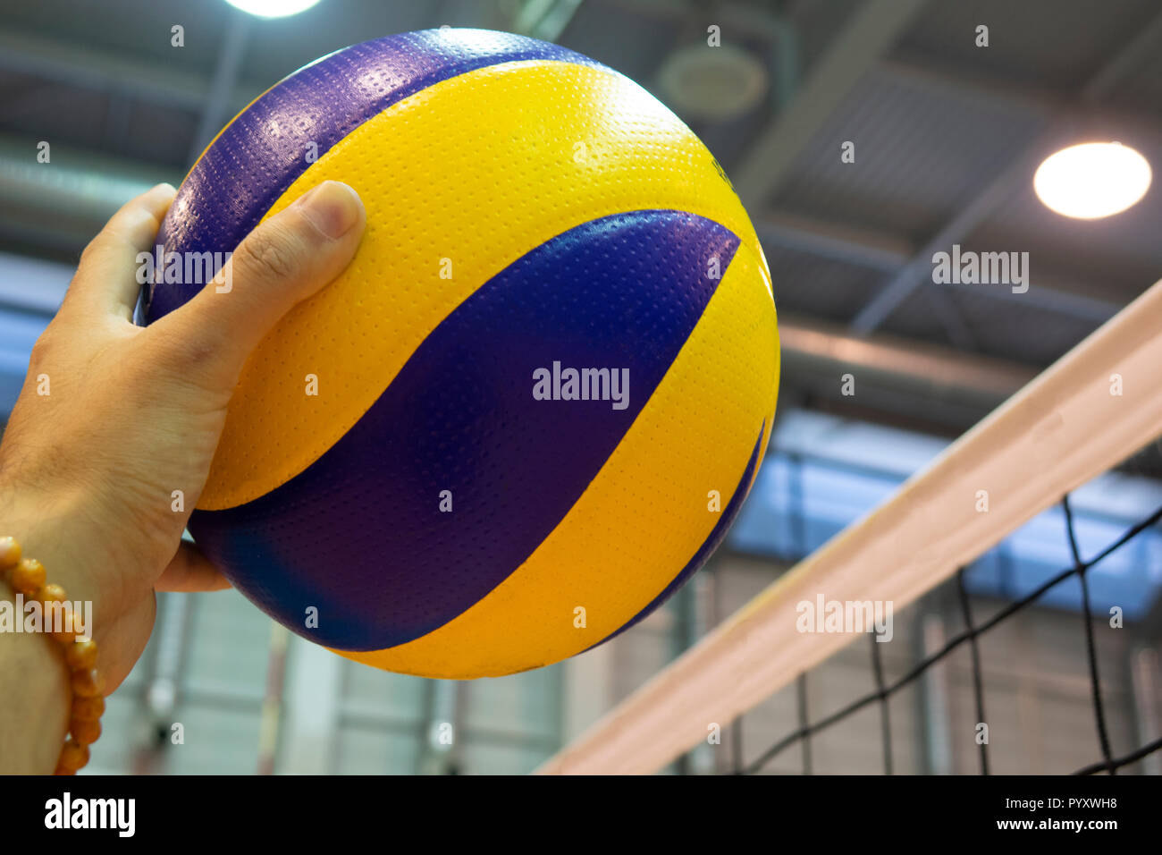 Volleyball spike hand block over the net Stock Photo