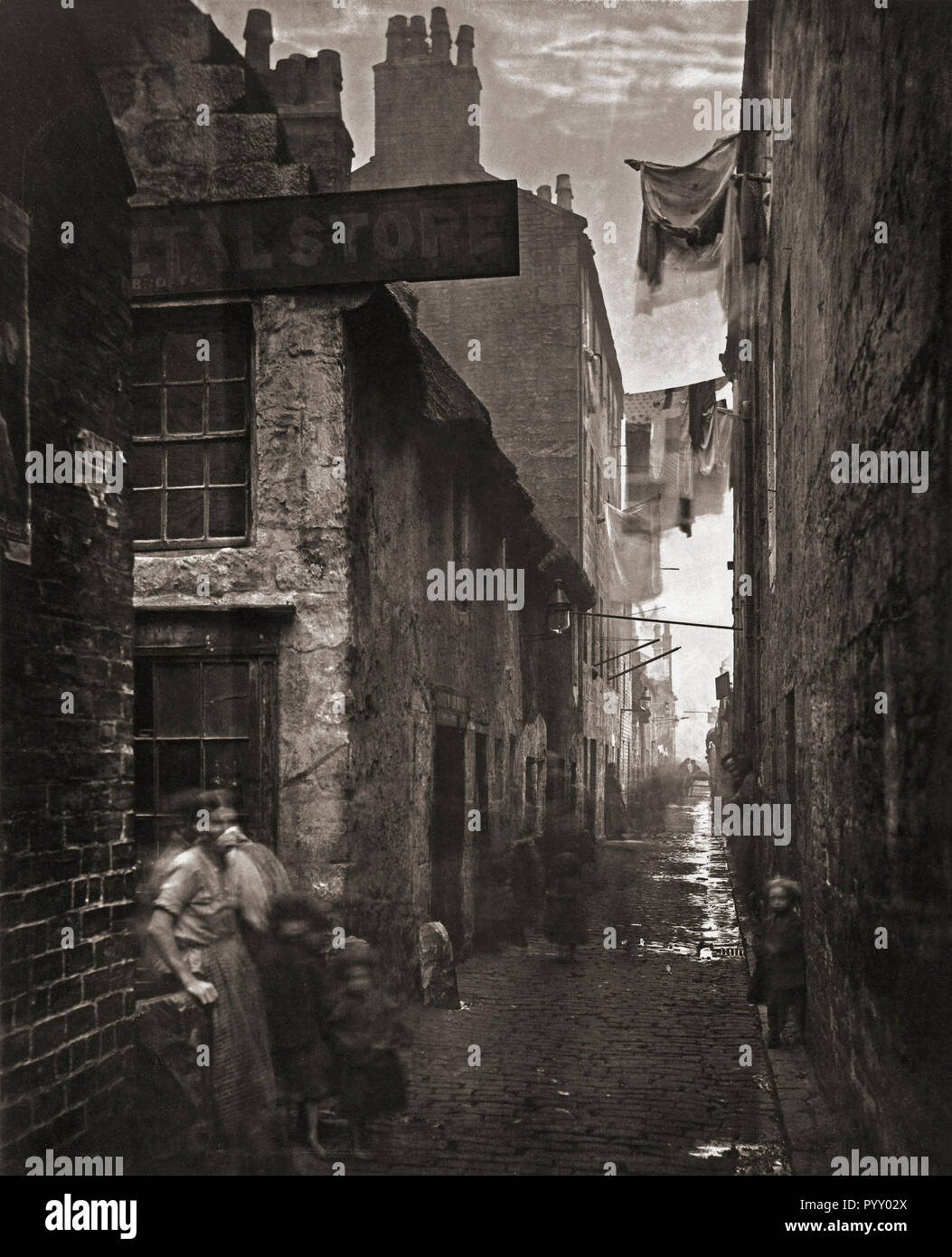 Old Vennel, off High Street, Glasgow,  Scotland in the 1870’s. Photograph from The Old Closes and Streets of Glasgow, by Scottish photographer Thomas Annan 1829-1887. Stock Photo