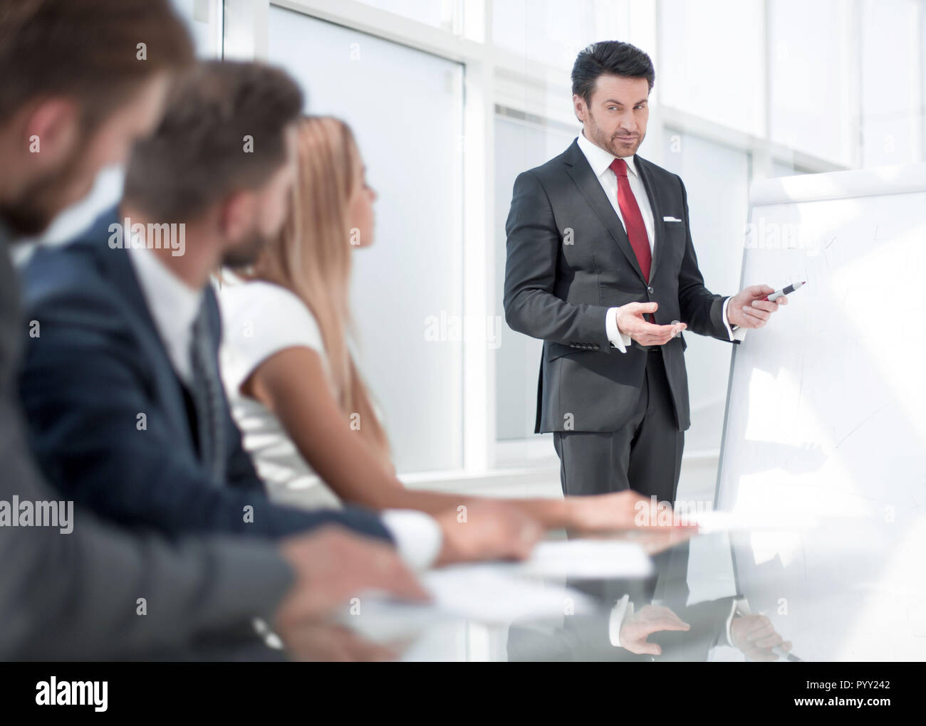 team leader giving presentation to his business colleagues Stock Photo ...