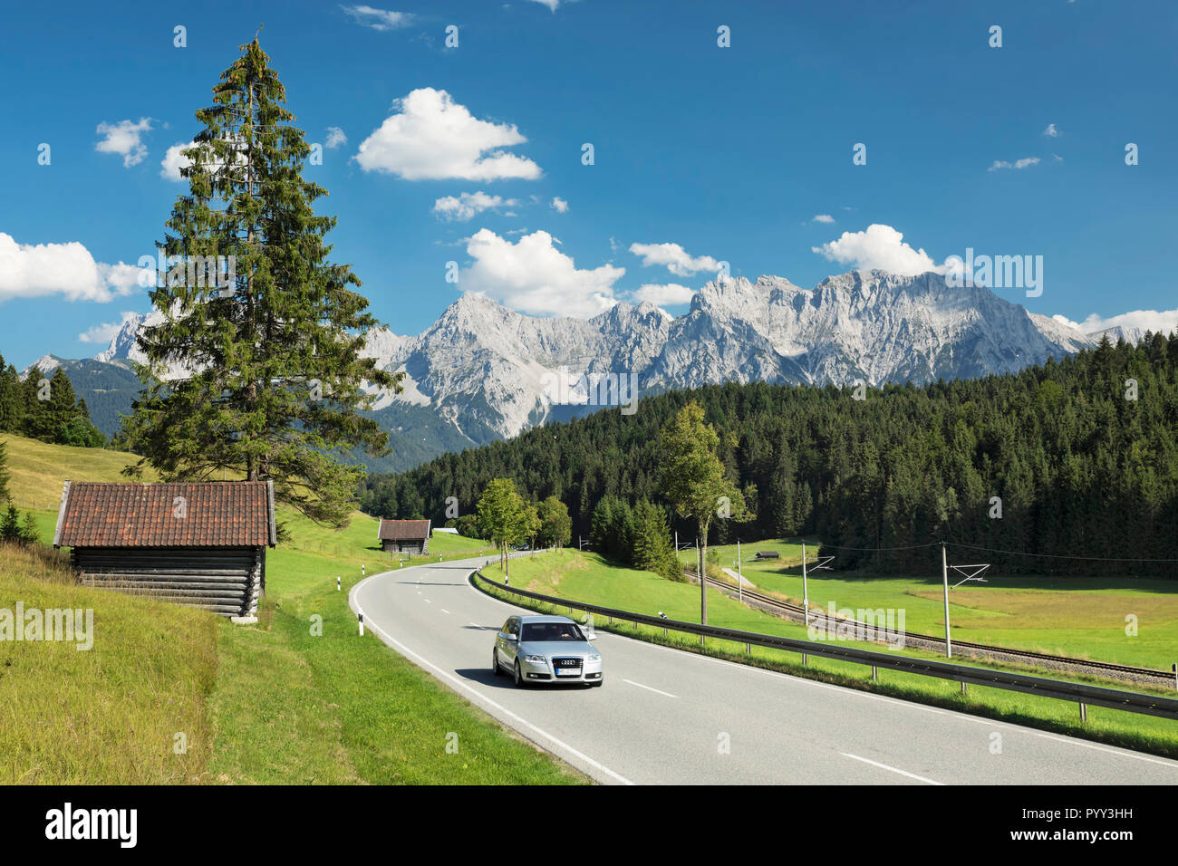 Alpine Road Car on road in mountain landscape, German Alpine Road in front of ...