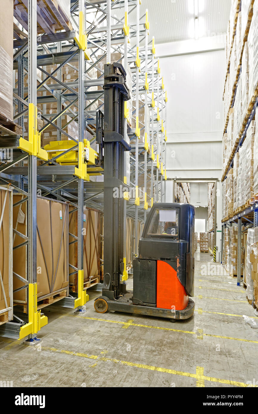 Forklift With Pallet Shuttle in Automated Warehouse Stock Photo