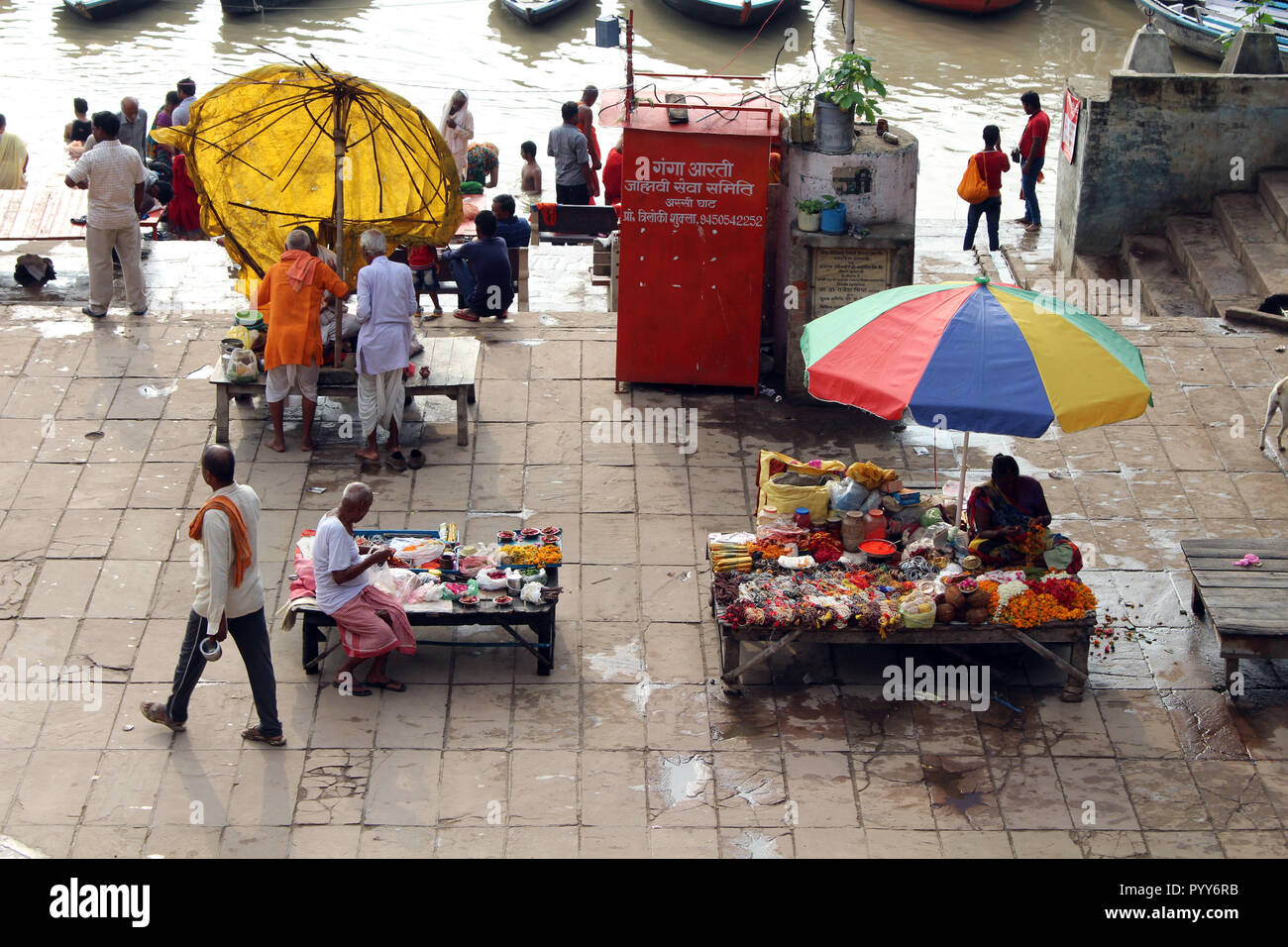 Watching local people busy preparing rituals at Assi Ghat in Varanasi by the Ganges. Taken in India, August 2018. Stock Photo