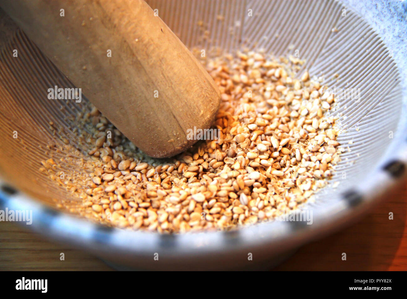 Grinding sesame Seeds in a Suribachi, Japanese mortar and pestle Stock Photo Alamy