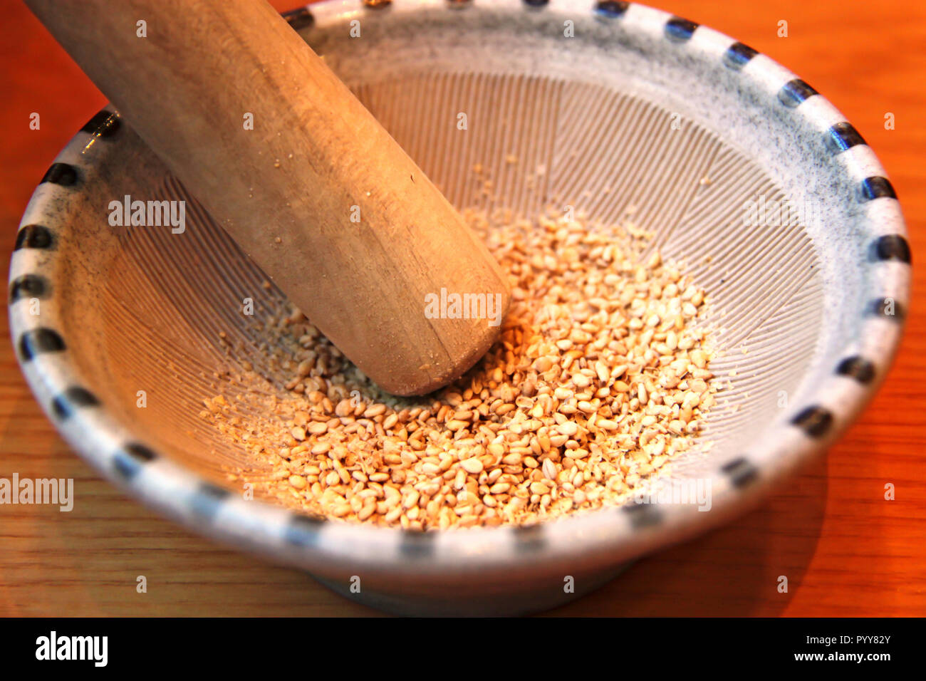 Sesame Seeds in a Suribachi, Japanese mortar and pestle Stock Photo Alamy