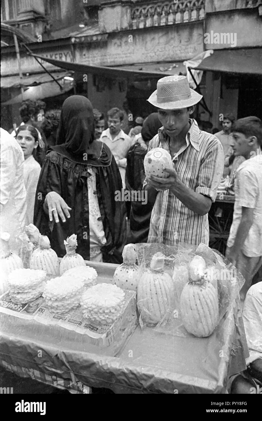 Couple buying pineapple fruit, Mumbai, Maharashtra, India, Asia, 1900s Stock Photo