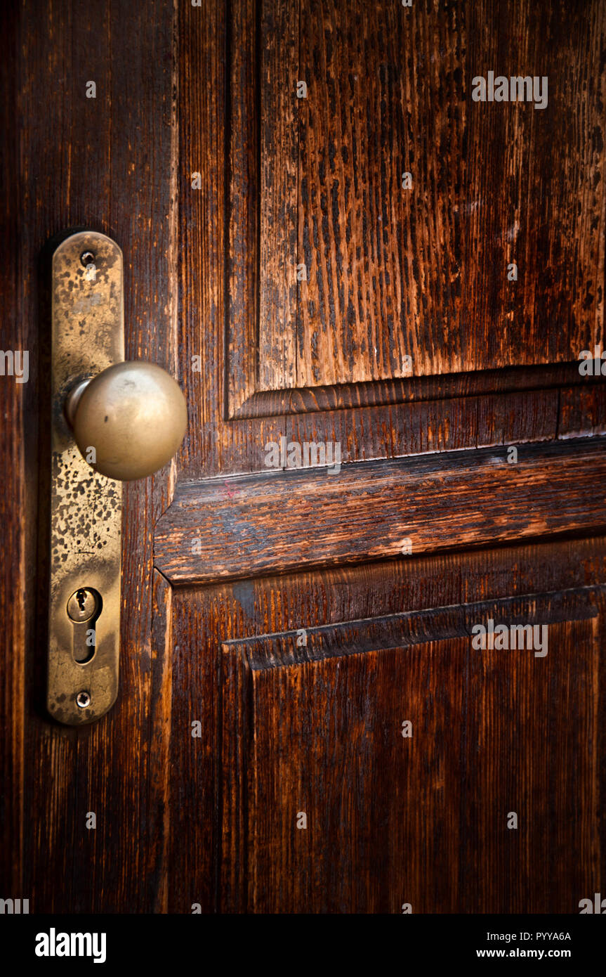 door knob and lock of an old wooden door Stock Photo