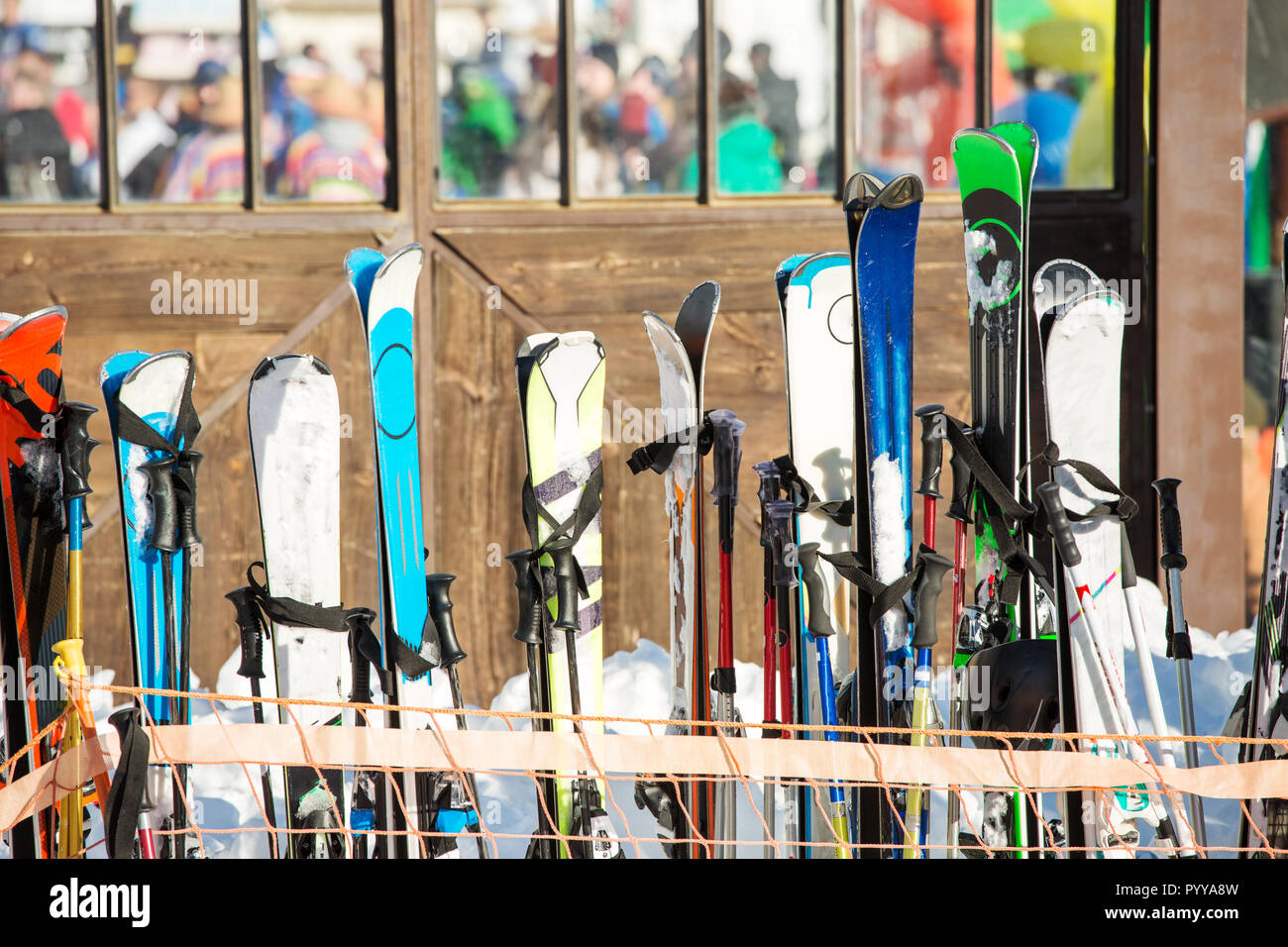 Photo of multi-colored skis in snow at winter resort Stock Photo