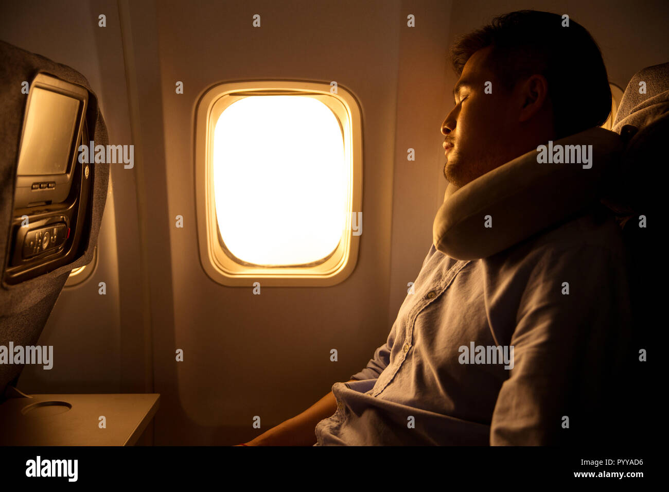 Young men by plane Stock Photo