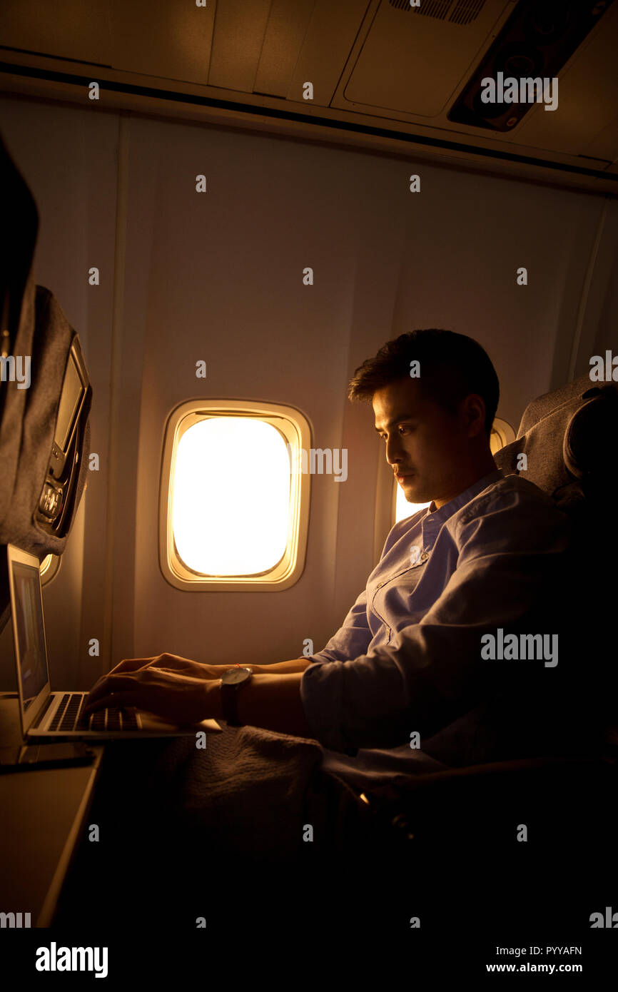 Young men by plane Stock Photo