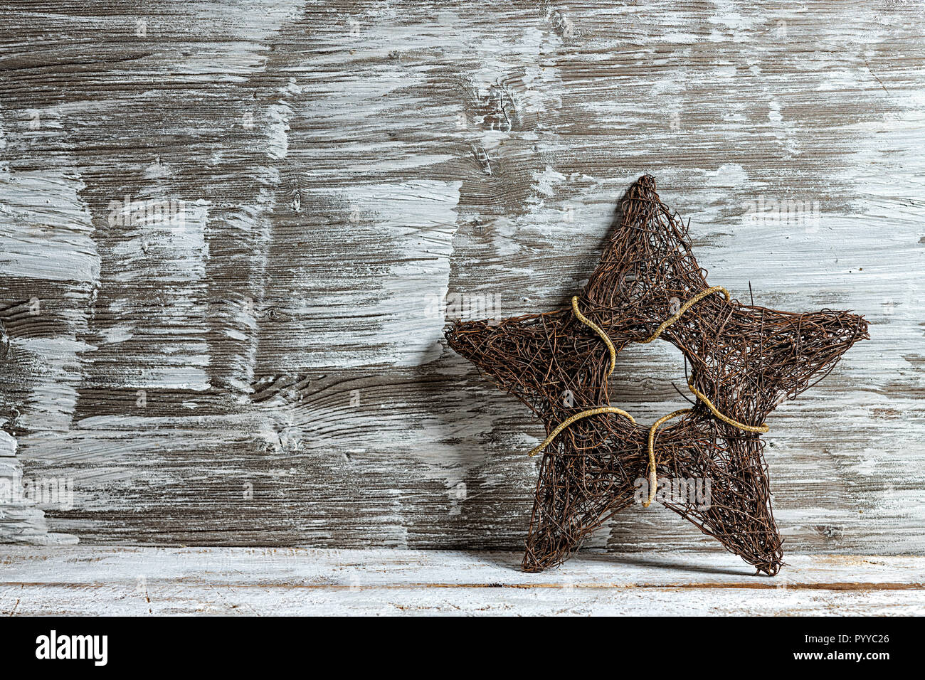 Christmas star on old vintage wooden table Stock Photo