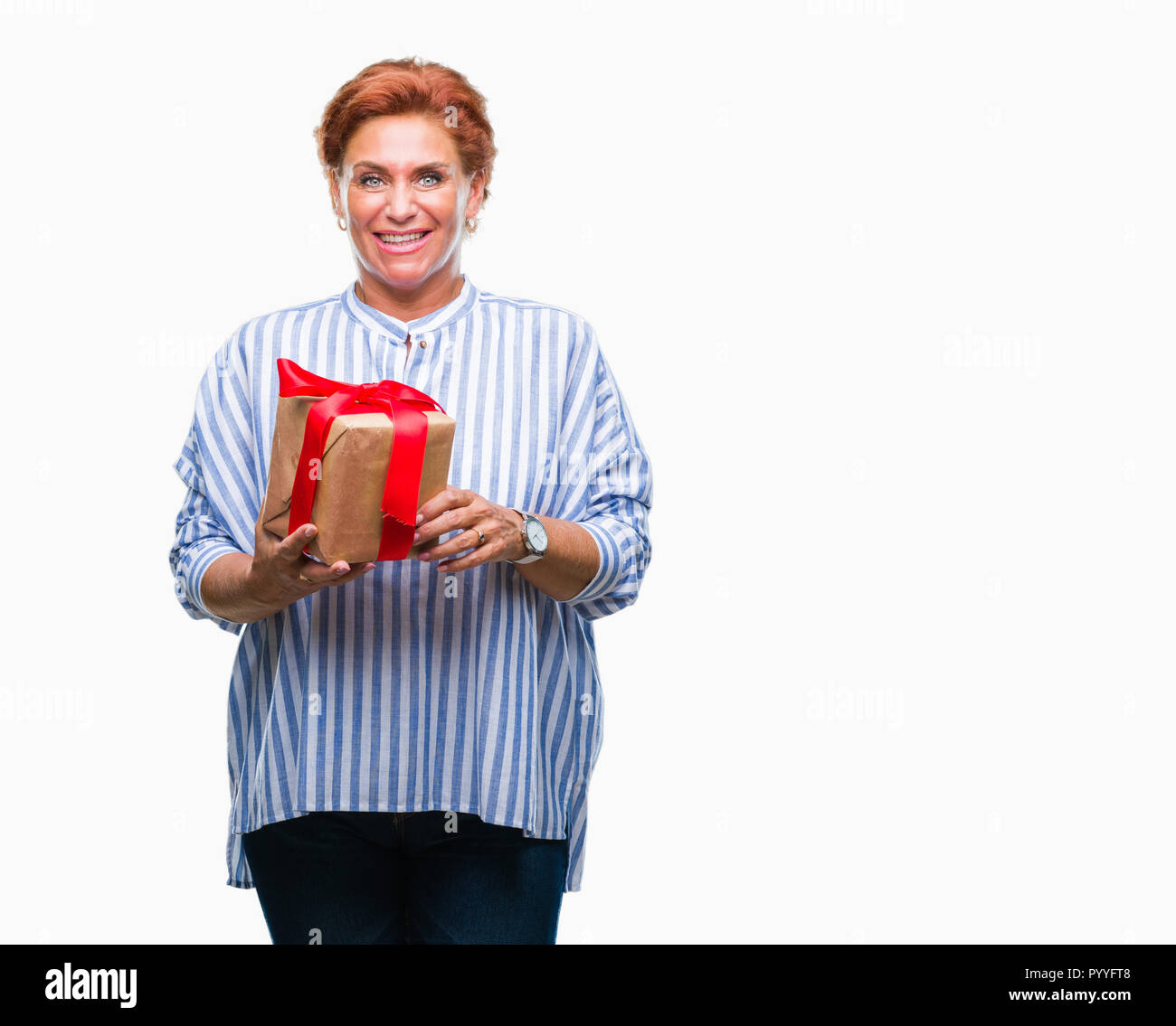 Senior caucasian woman holding gift over isolated background with a ...