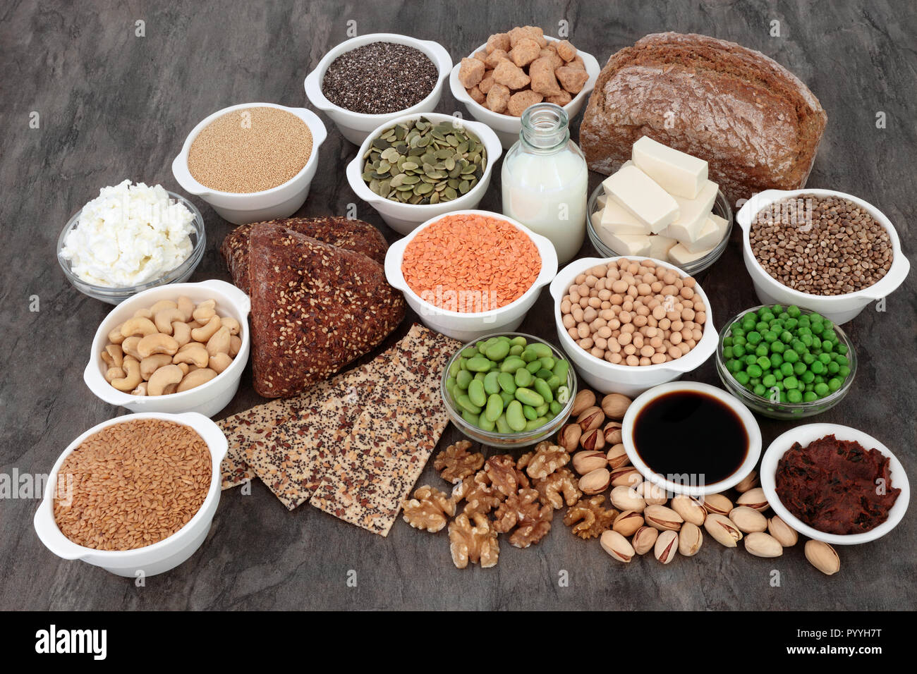 Vegan health food with tofu bean curd, legumes, nuts, seeds, wholegrain