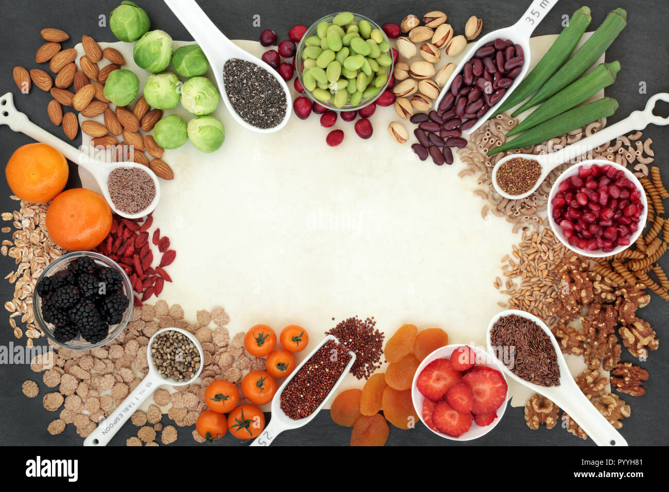 High fibre super food background border with fruit, vegetables, seeds