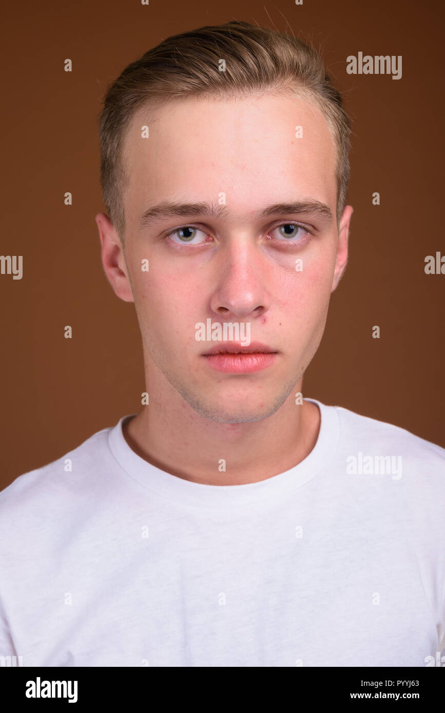 Face Of Young Handsome Man With Blond Hair Stock Photo 223727115