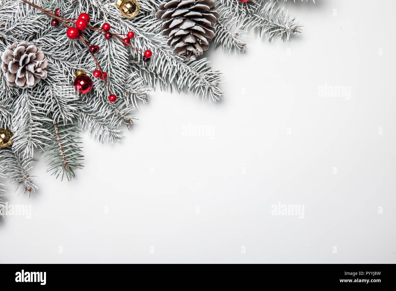 Christmas background with snow fir tree and decoration. Top view with ...