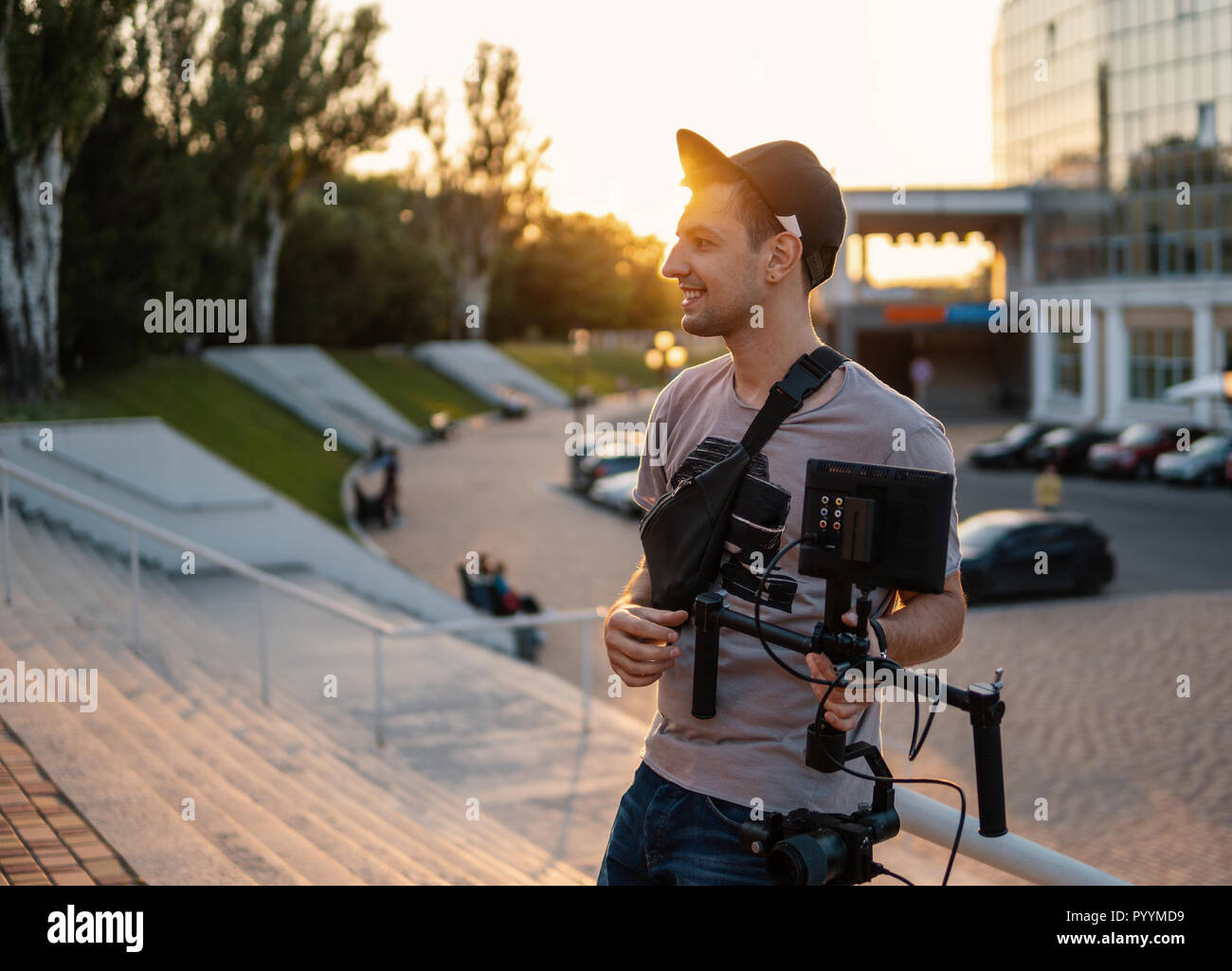 Videographer with video equipment, steadicam 3 axis gimbal Stock Photo