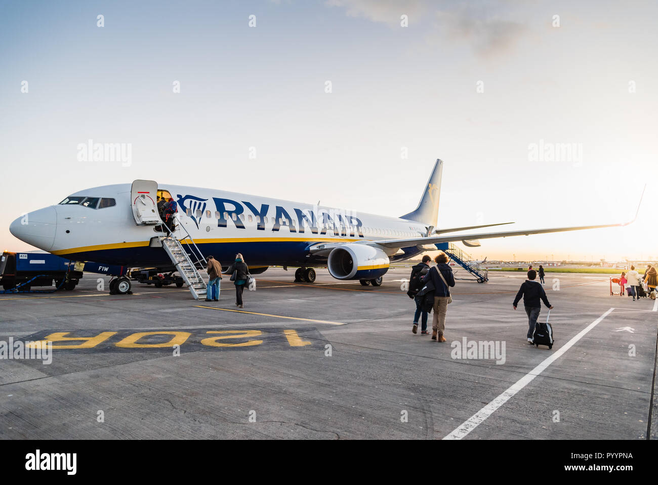 Dublin, Ireland - November 12, 2017: Passengers are boarding on Ryanair Boeing 737-800 airplane in the runaway of the Dublin Airport short before take Stock Photo