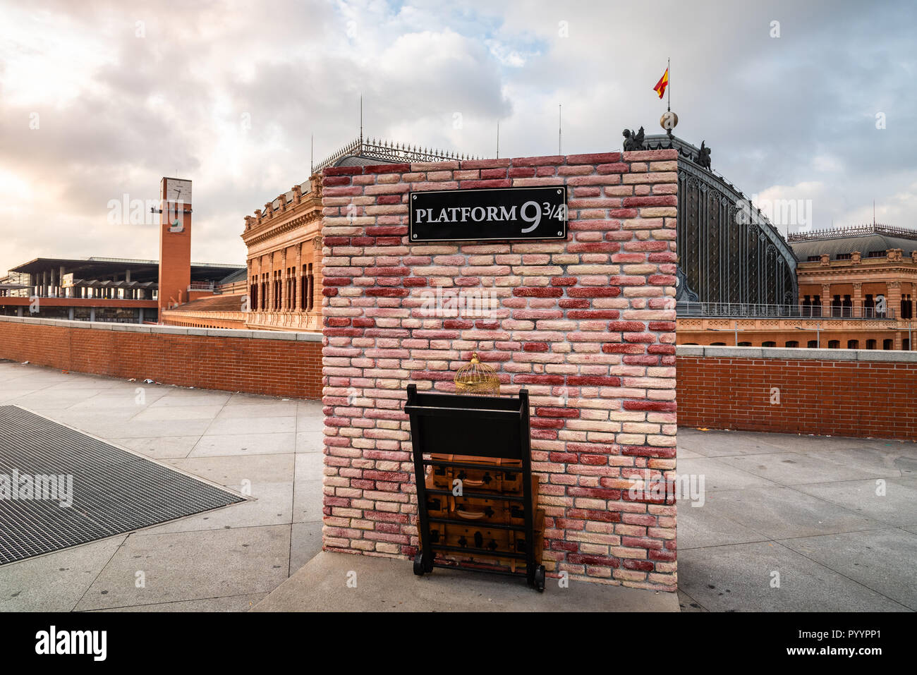 Madrid, Spain - October 27, 2018: Platform nine and three quarters of Harry Potter in Atocha Railway Station at sunrise. Stock Photo