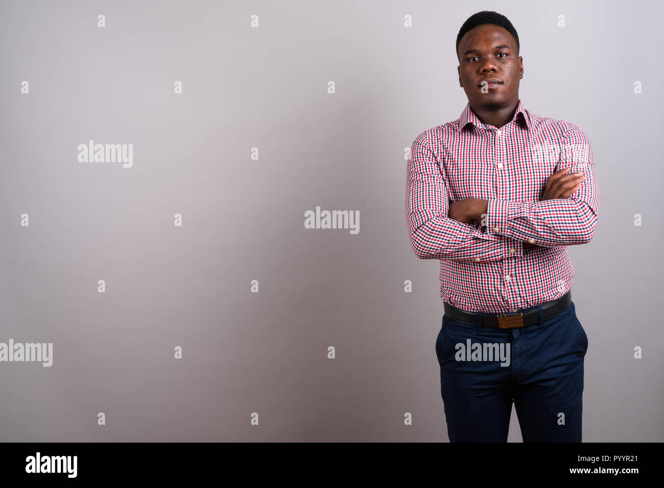 African american man standing arms hi-res stock photography and images ...